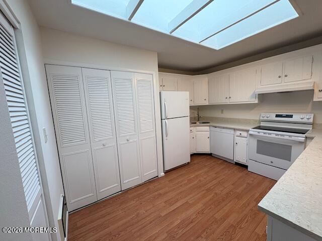 15 Lexington Court Red Bank, NJ 07701 - Photo 5 of 21 a kitchen with white cabinets and white appliances