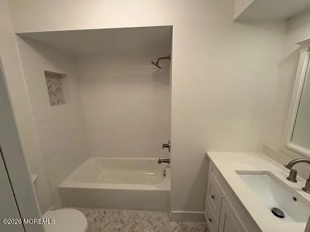 a bathroom with a tub sink and mirror