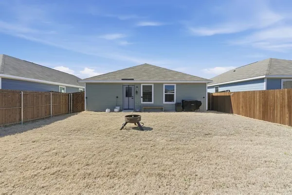 a house with yard in front of it