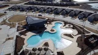 an aerial view of a house with outdoor space