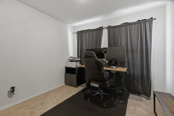 a view of a workspace with furniture