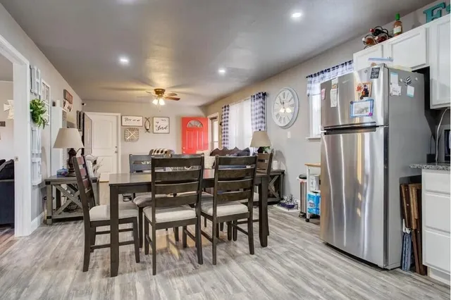 a view of a dining room with furniture window and wooden floor