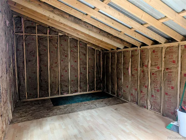 a view of a room with wooden walls
