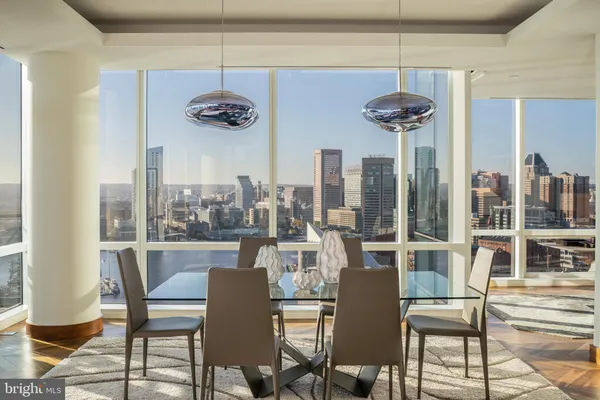 a view of a dining room with furniture window and outside view