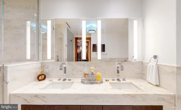a bathroom with a tub sink and a mirror