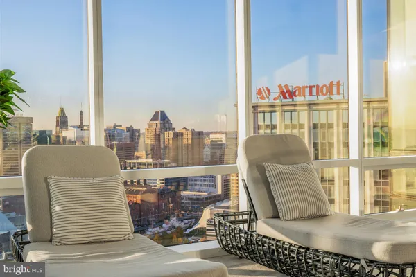 a view of a balcony with chair and table