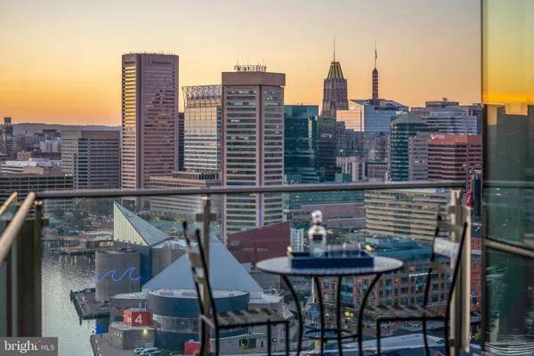 a view of a balcony with two chairs and a table