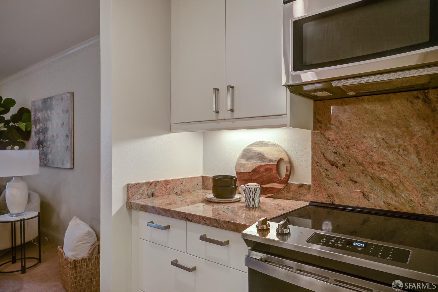 1171 Compass Lane, Unit 209 Foster City, CA 94404 - Photo 11 of 55 a stove top oven sitting inside of a kitchen