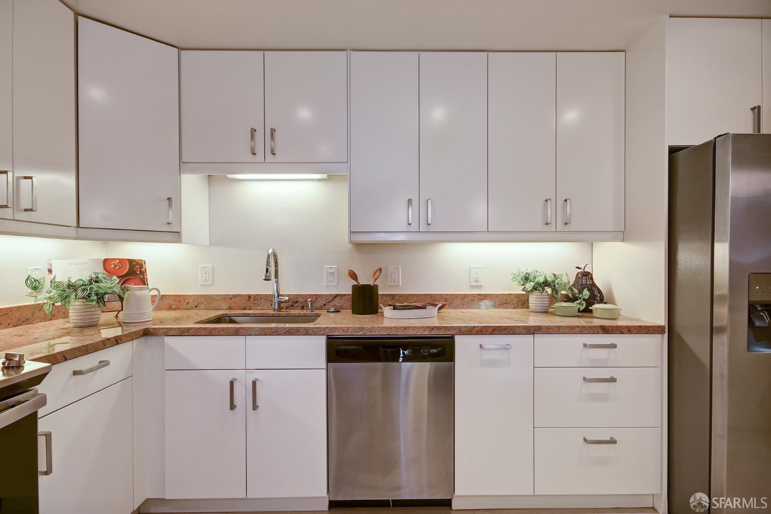 1171 Compass Lane, Unit 209 Foster City, CA 94404 - Photo 14 of 55 a kitchen with stainless steel appliances granite countertop a sink and dishwasher with white cabinets