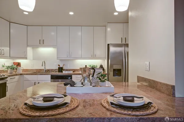 a bedroom with furniture and a potted plant