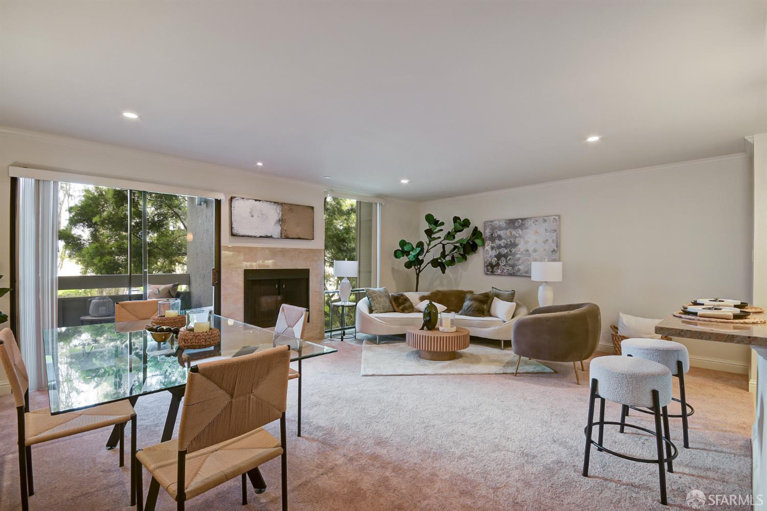 1171 Compass Lane, Unit 209 Foster City, CA 94404 - Photo 2 of 55 a living room with furniture a fireplace and a floor to ceiling window