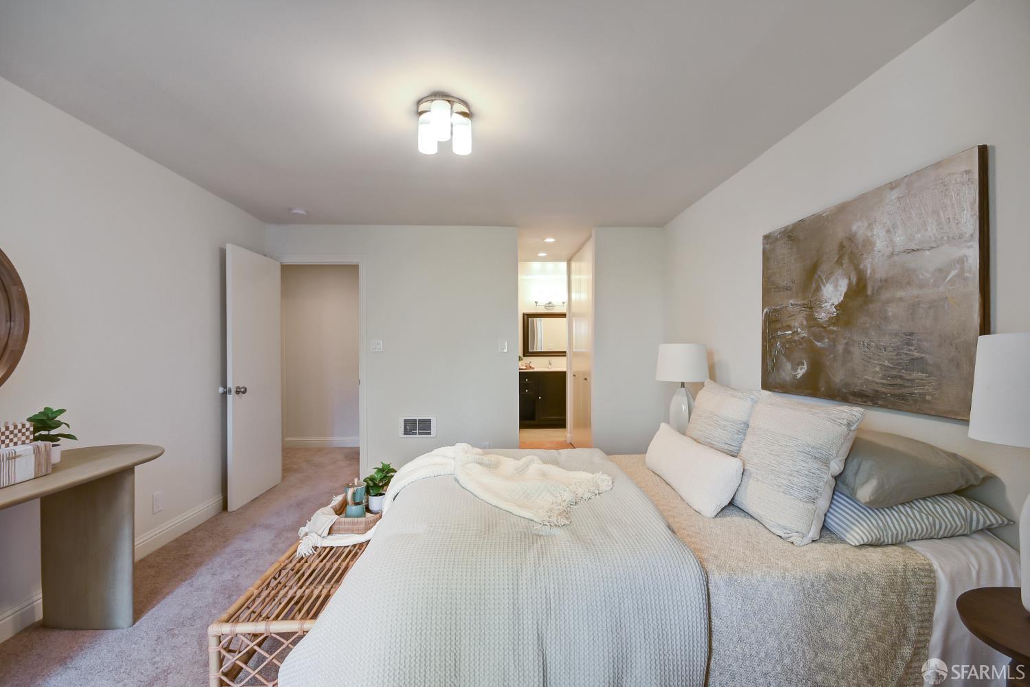 1171 Compass Lane, Unit 209 Foster City, CA 94404 - Photo 24 of 55 a bedroom with a bed and a lamp on dresser