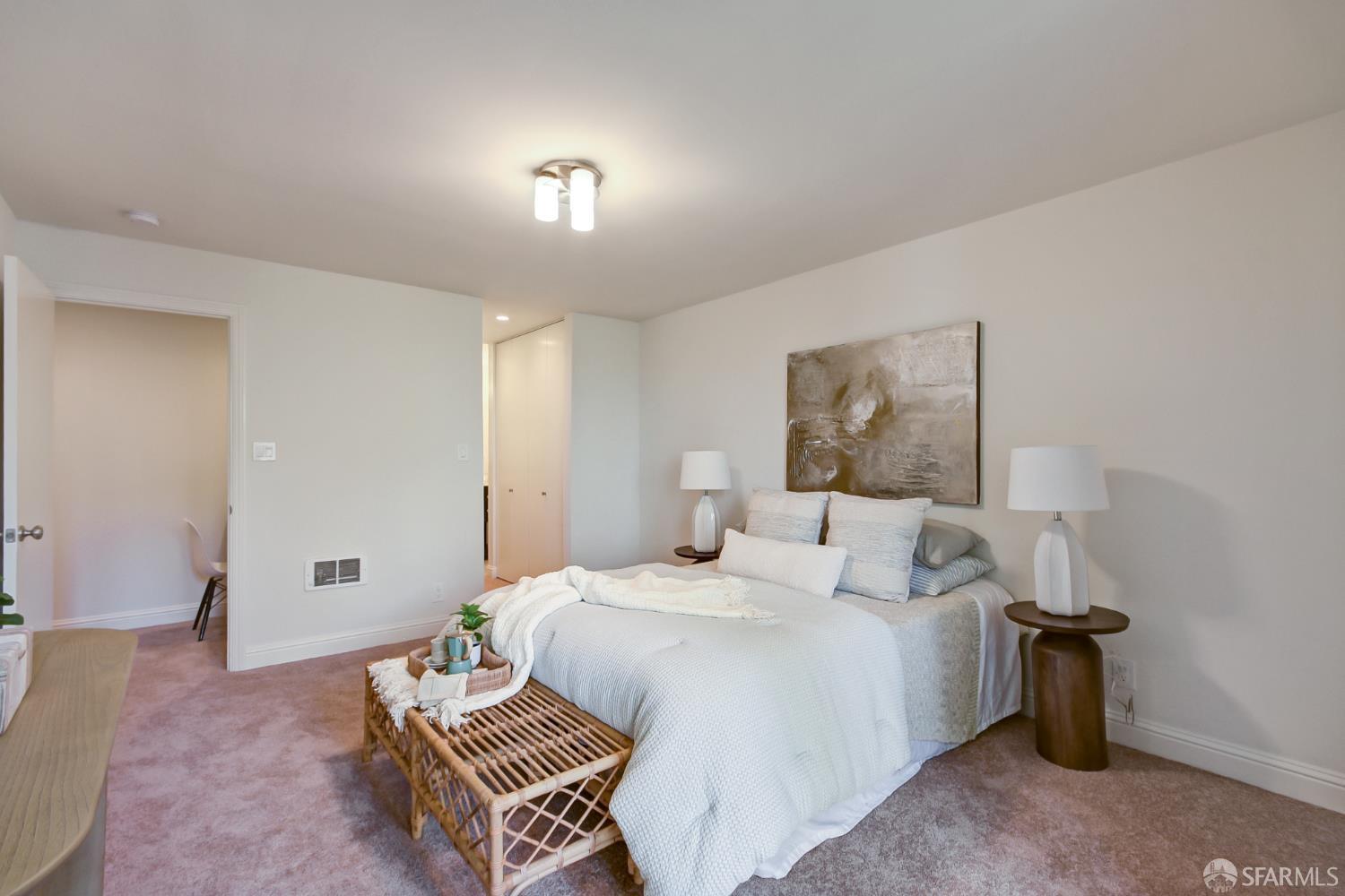1171 Compass Lane, Unit 209 Foster City, CA 94404 - Photo 25 of 55 a bedroom with a large bed and a chandelier