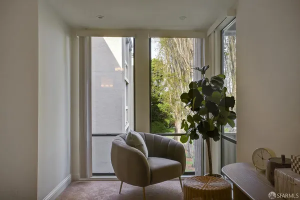 a dining room with furniture and wooden floor