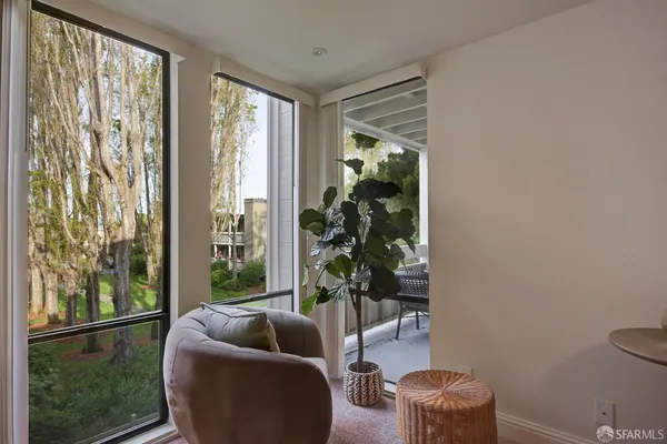 a living room with furniture and a night stand