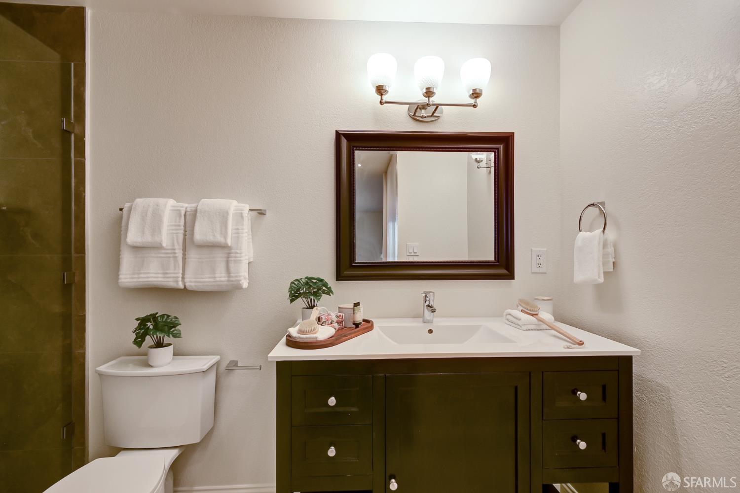 1171 Compass Lane, Unit 209 Foster City, CA 94404 - Photo 35 of 55 a bathroom with a toilet sink and mirror