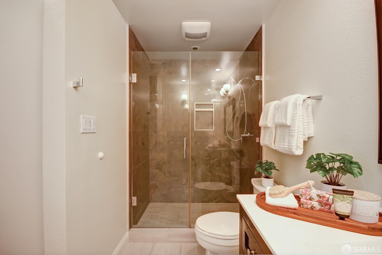 1171 Compass Lane, Unit 209 Foster City, CA 94404 - Photo 36 of 55 a bathroom with a sink a toilet and shower