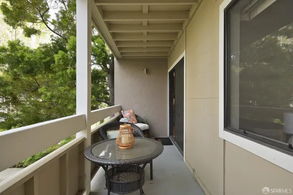 a view of a park with a bench and a slide