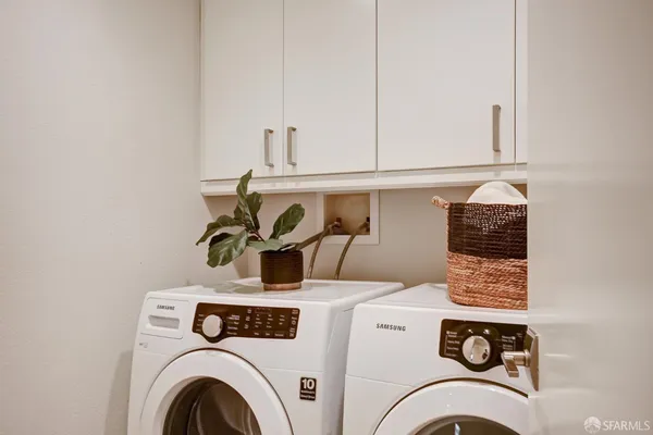 a view of a livingroom with furniture and windows