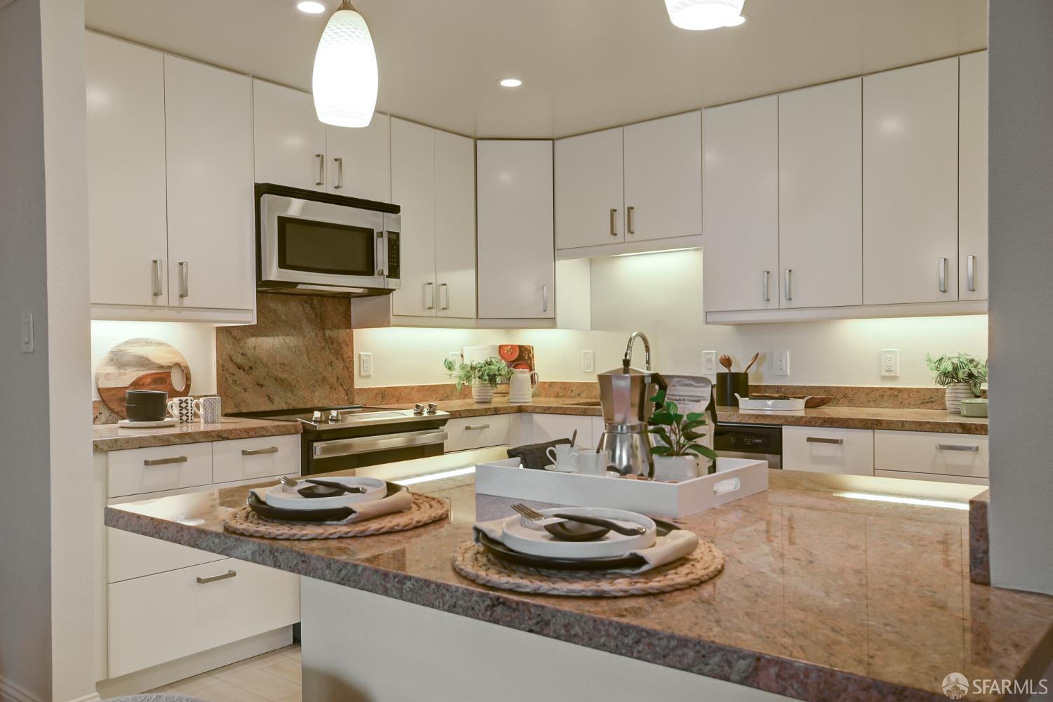 1171 Compass Lane, Unit 209 Foster City, CA 94404 - Photo 9 of 55 a kitchen with a sink stove and cabinets
