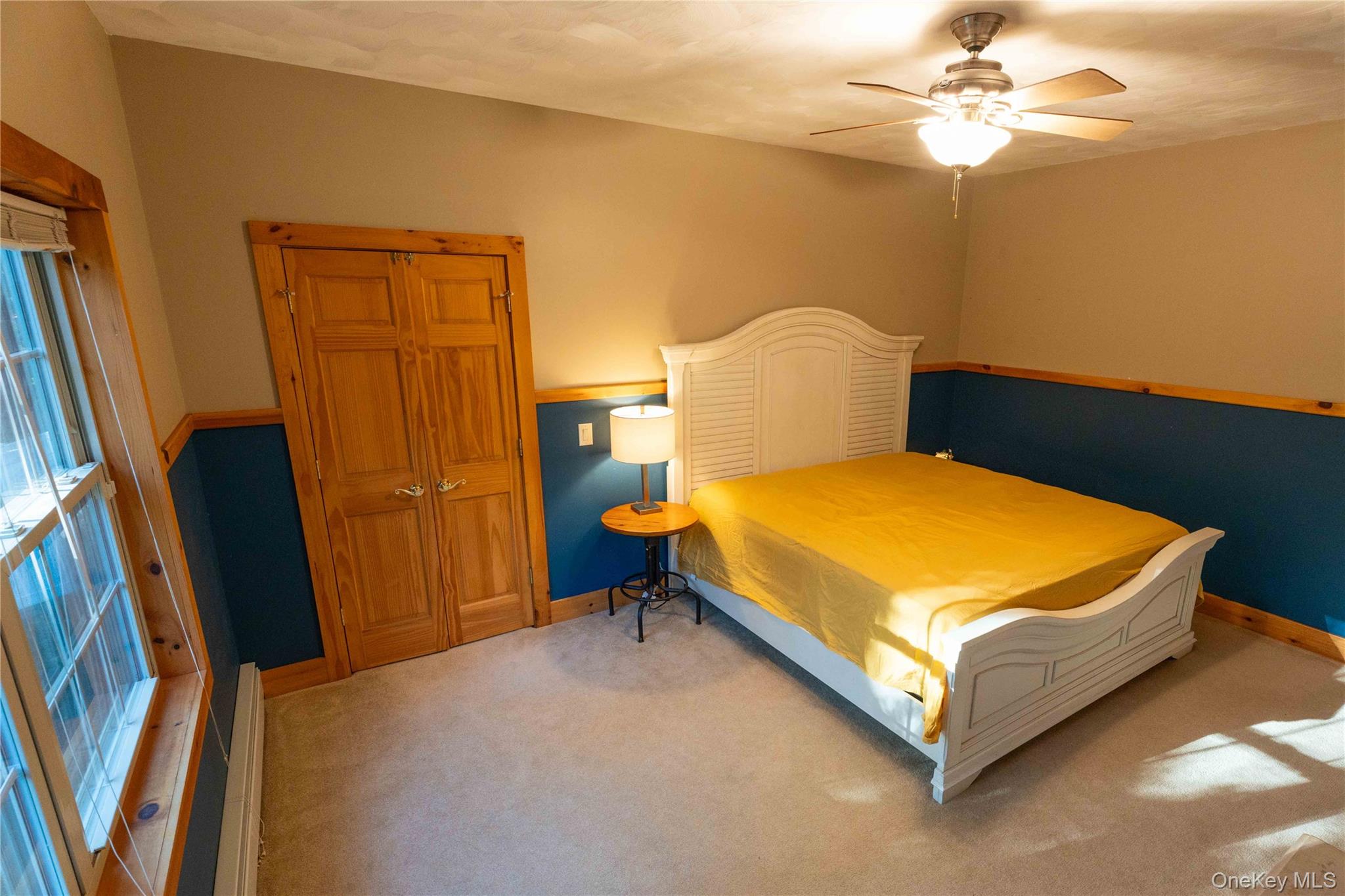 109 3rd Street Godeffroy, NY 12729 - Photo 13 of 16 a bed sitting in a room next to a window