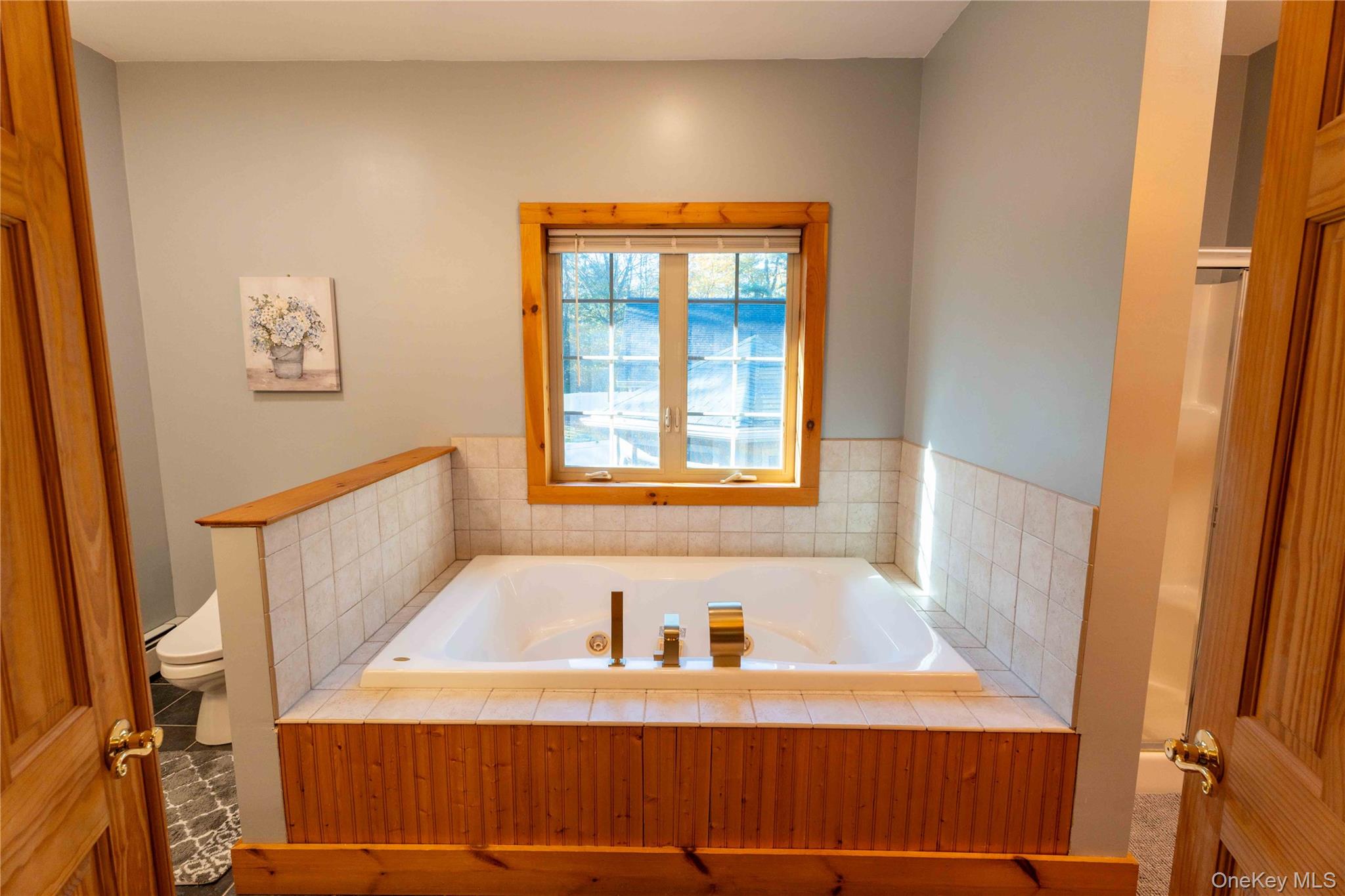 109 3rd Street Godeffroy, NY 12729 - Photo 10 of 16 a bathroom with a bathtub and a window