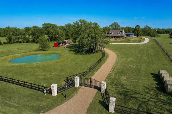 a view of a lake with a yard