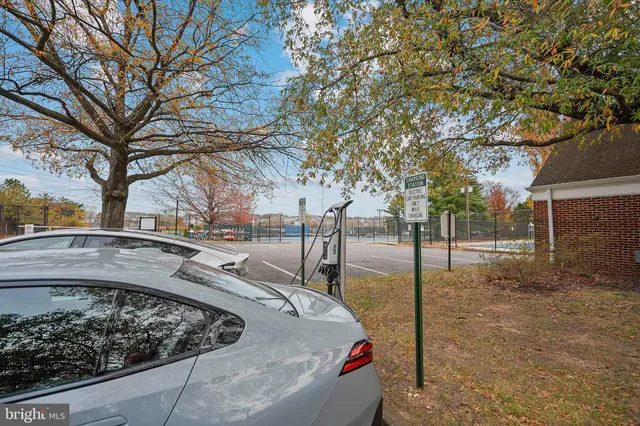a living room with lots of books and a book shelf