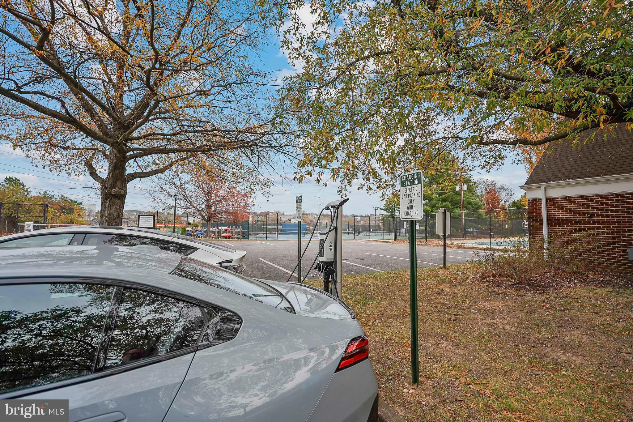 1225 Martha Custis Drive, Unit 1119 Alexandria, VA 22302 - Photo 22 of 36 a view of a yard with trees
