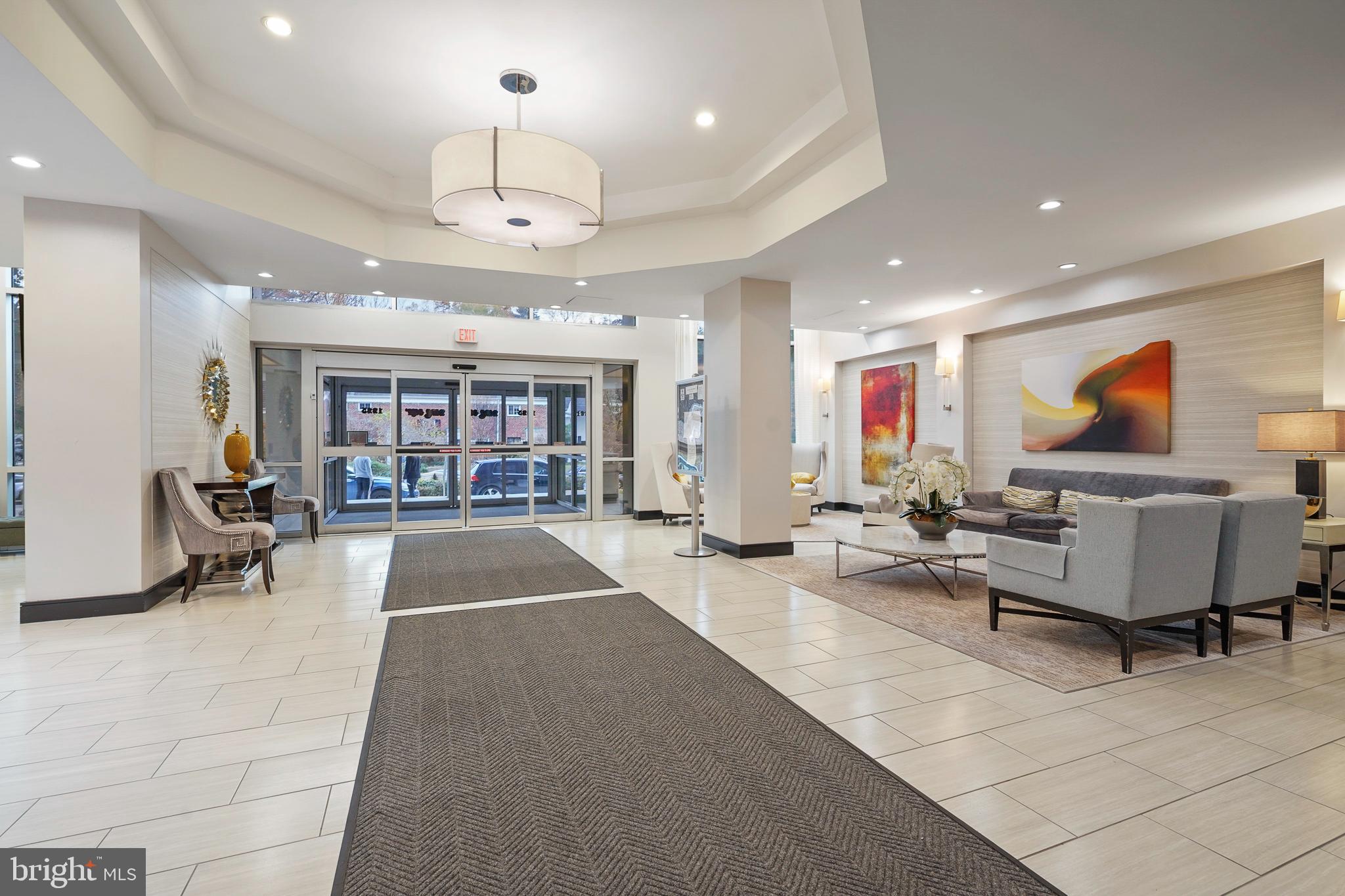 1225 Martha Custis Drive, Unit 1119 Alexandria, VA 22302 - Photo 32 of 36 a living room with furniture and a flat screen tv