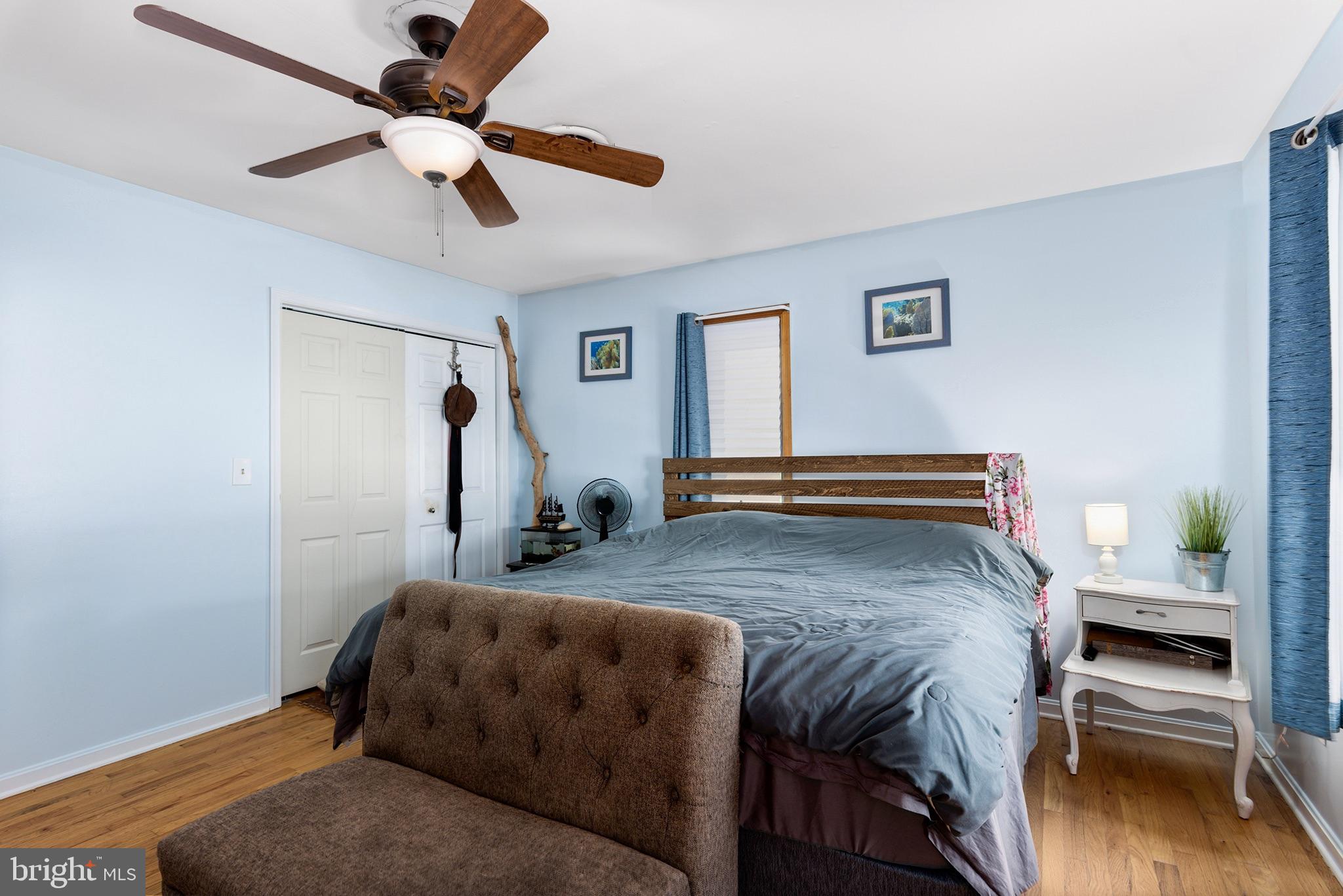 33 Low Road Earleville, MD 21919 - Photo 18 of 35 a bedroom with a bed and a chandelier