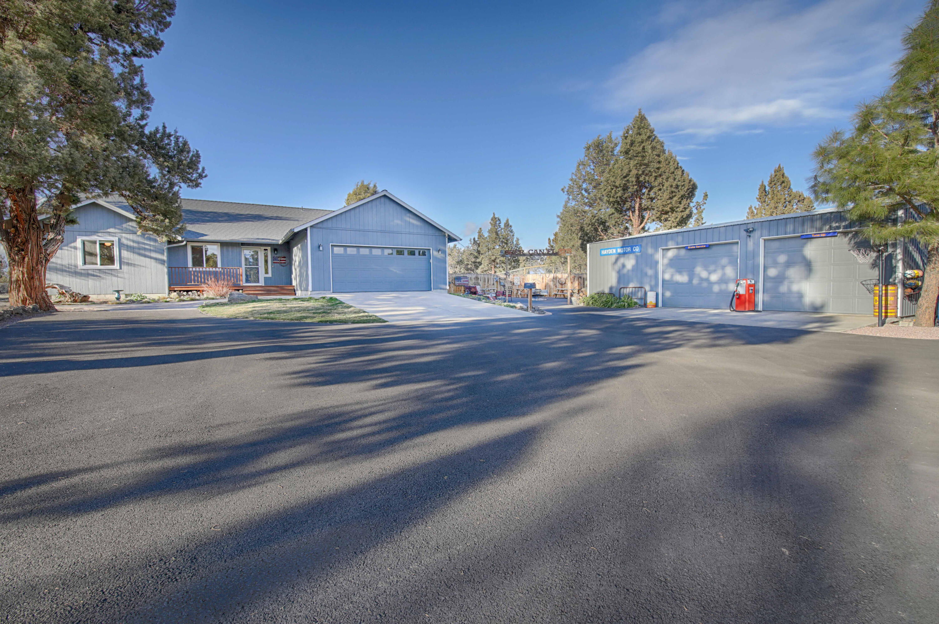 64818 Grande Loop Bend, OR 97701 - Photo 2 of 29 Attached 2 car garage plus large 24x36 insulated shop! 220 power and carport to the side.