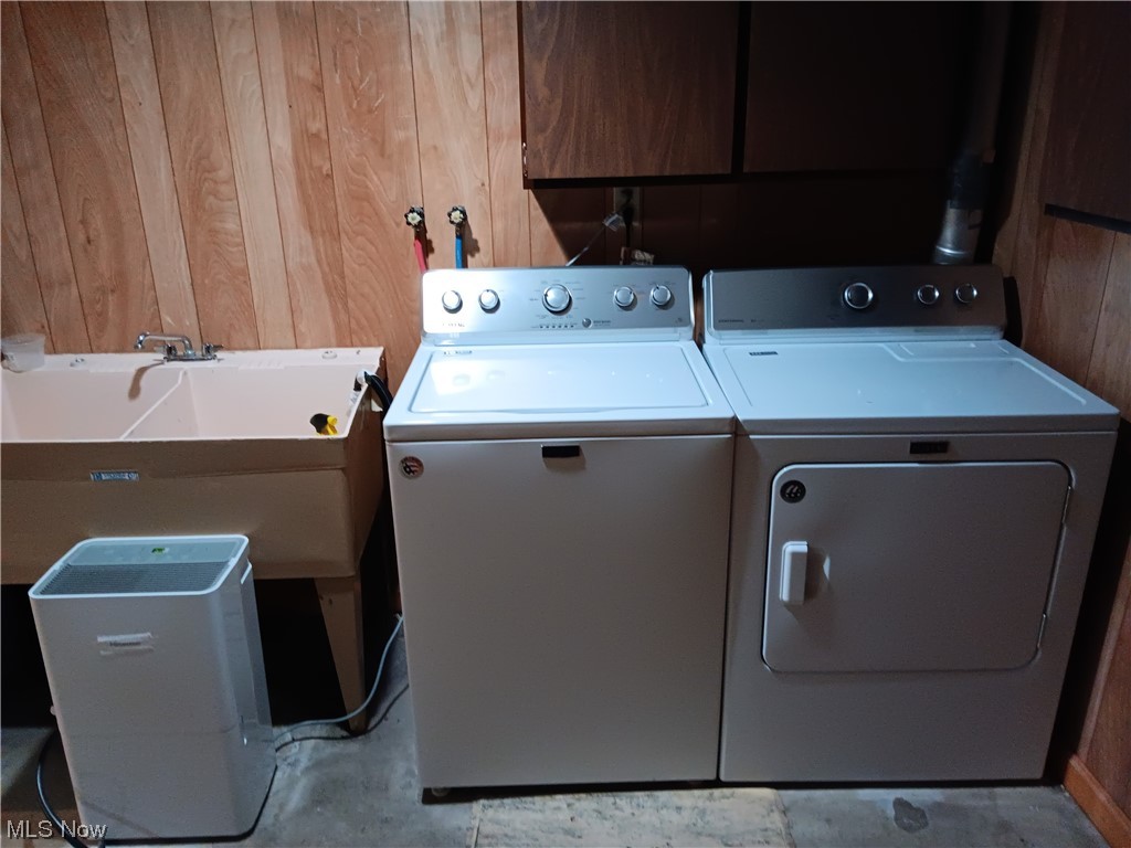 349 Jacobs Road Hubbard, OH 44425 - Photo 22 of 33 Laundry area with hookup for a washing machine, wood walls, sink, and washer and dryer