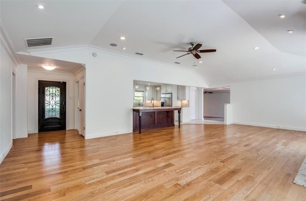 13038 Copenhill Road Dallas, TX 75240 - Photo 7 of 15 Hardwood flooring throughout, recessed lighting, ceiling fan, and a kitchen pass-through with a breakfast bar
