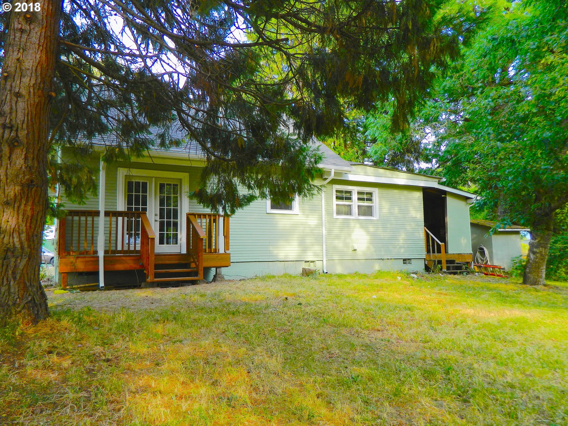 38323 Wheeler Road Dexter, OR 97431 - Photo 12 of 32 front view of a house with a yard