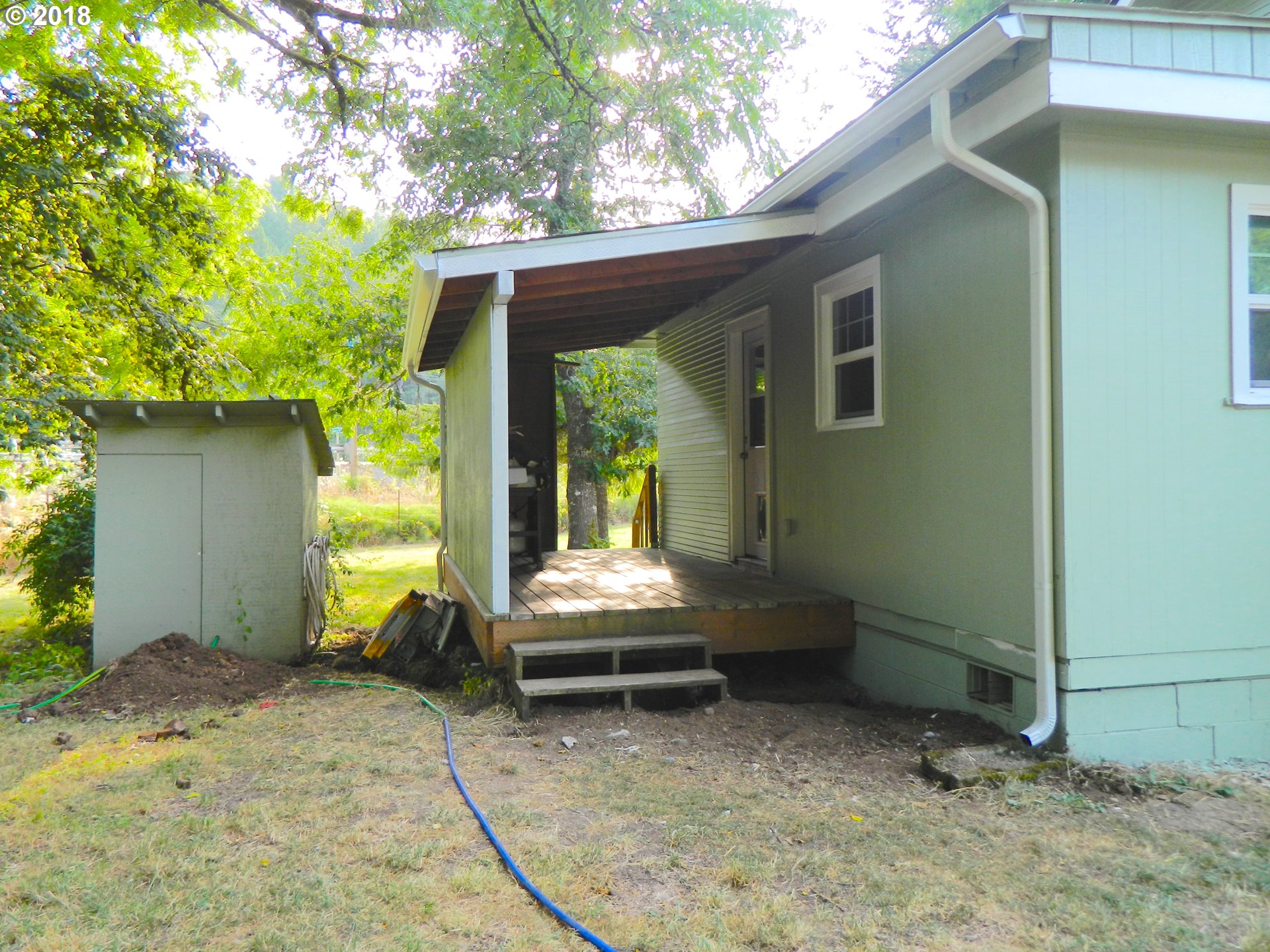 38323 Wheeler Road Dexter, OR 97431 - Photo 16 of 32 a view of a porch with a small yard