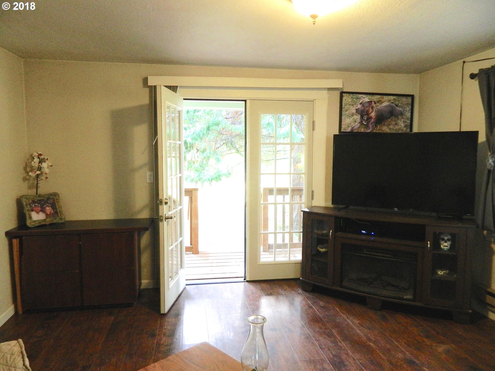 38323 Wheeler Road Dexter, OR 97431 - Photo 21 of 32 a living room with furniture and a flat screen tv