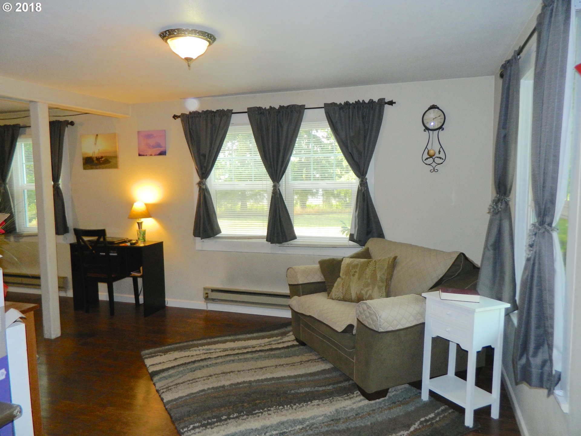 38323 Wheeler Road Dexter, OR 97431 - Photo 23 of 32 a living room with furniture and a large window
