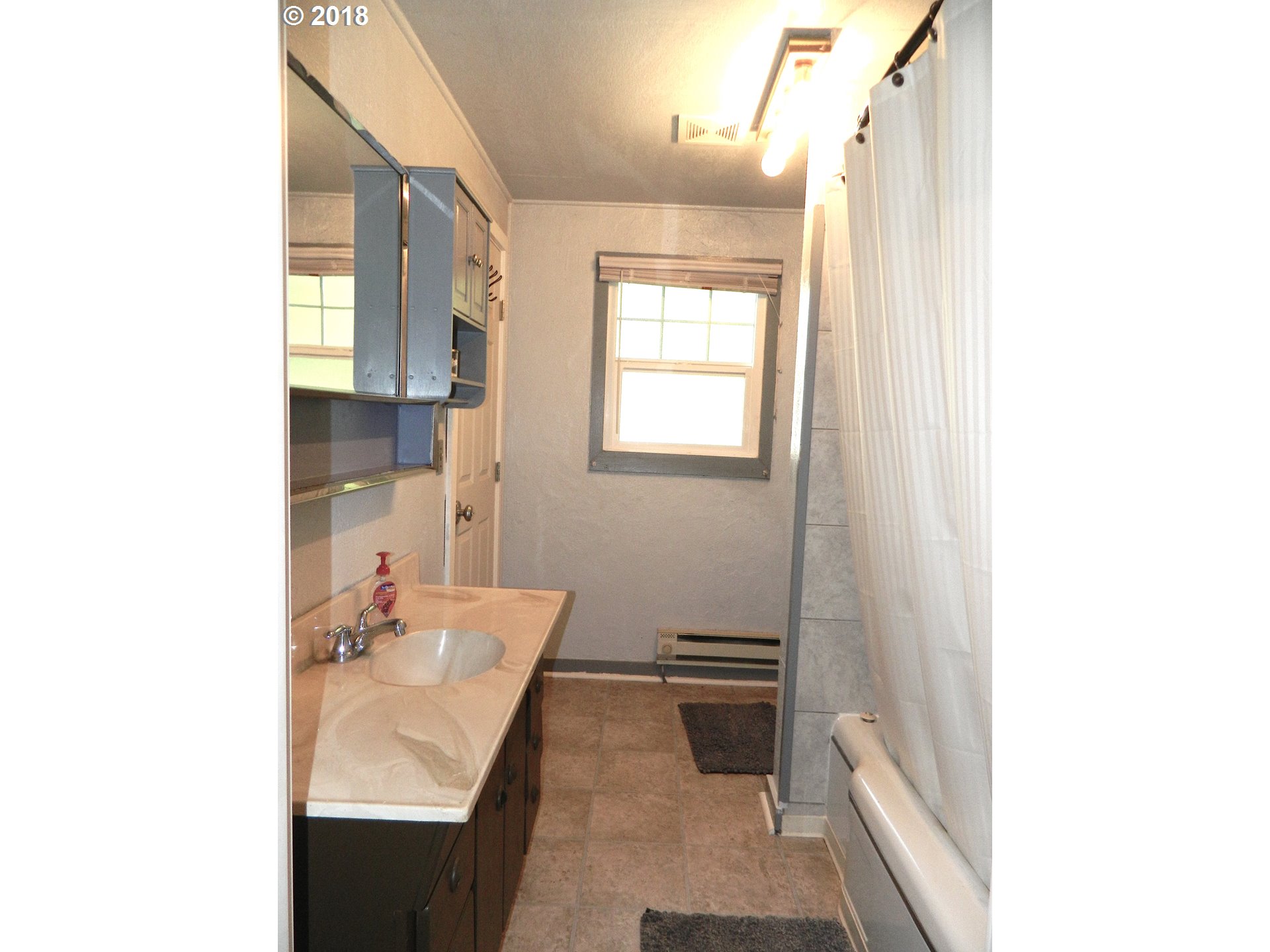 38323 Wheeler Road Dexter, OR 97431 - Photo 26 of 32 a bathroom with a sink and a mirror