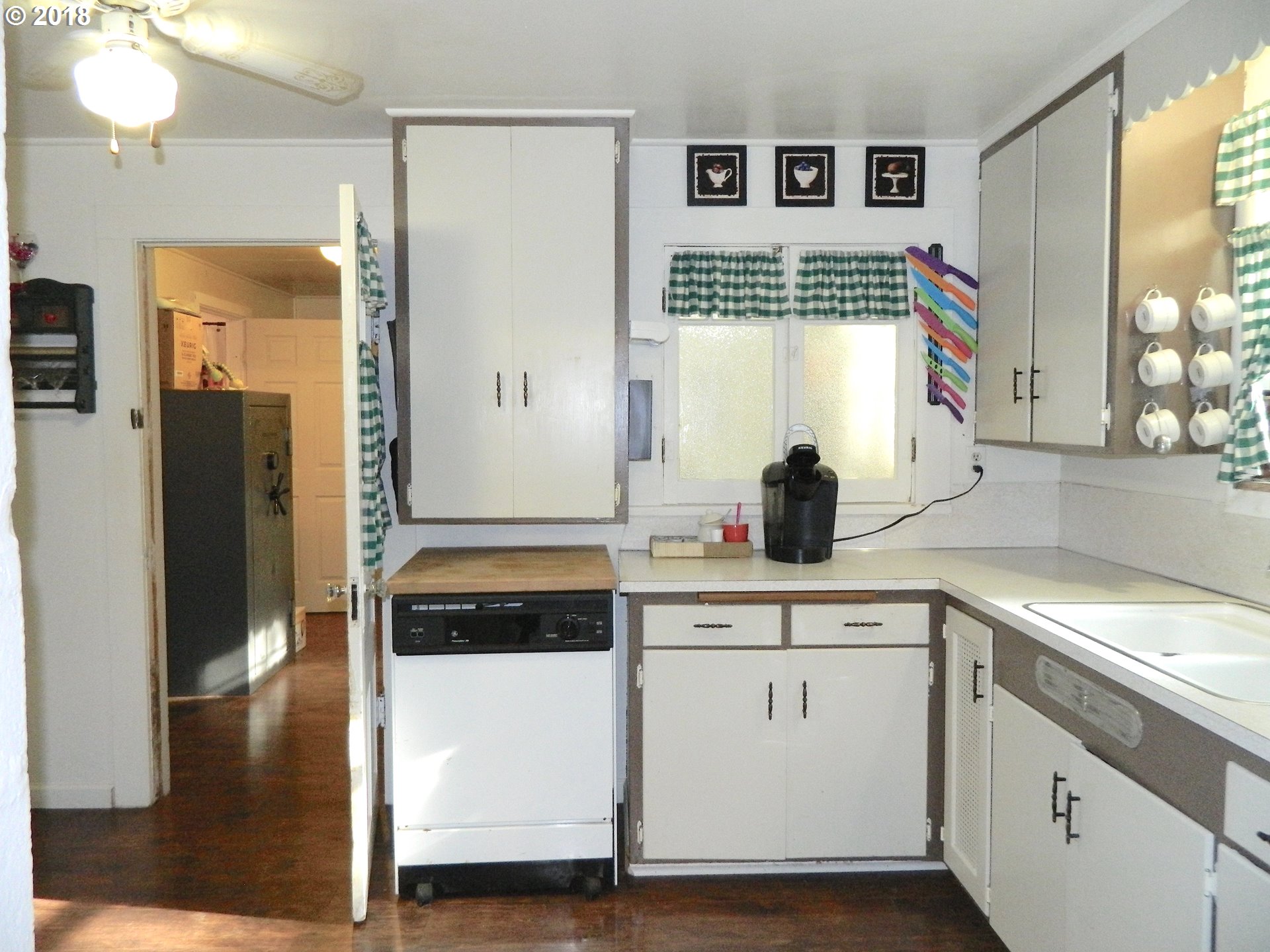 38323 Wheeler Road Dexter, OR 97431 - Photo 29 of 32 a kitchen with a white cabinets and window