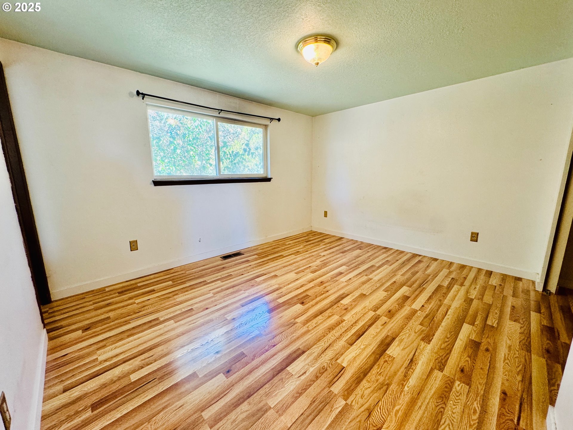 1275 West 1st Street Arlington, OR 97812 - Photo 16 of 24 a view of a room with wooden floor and small space