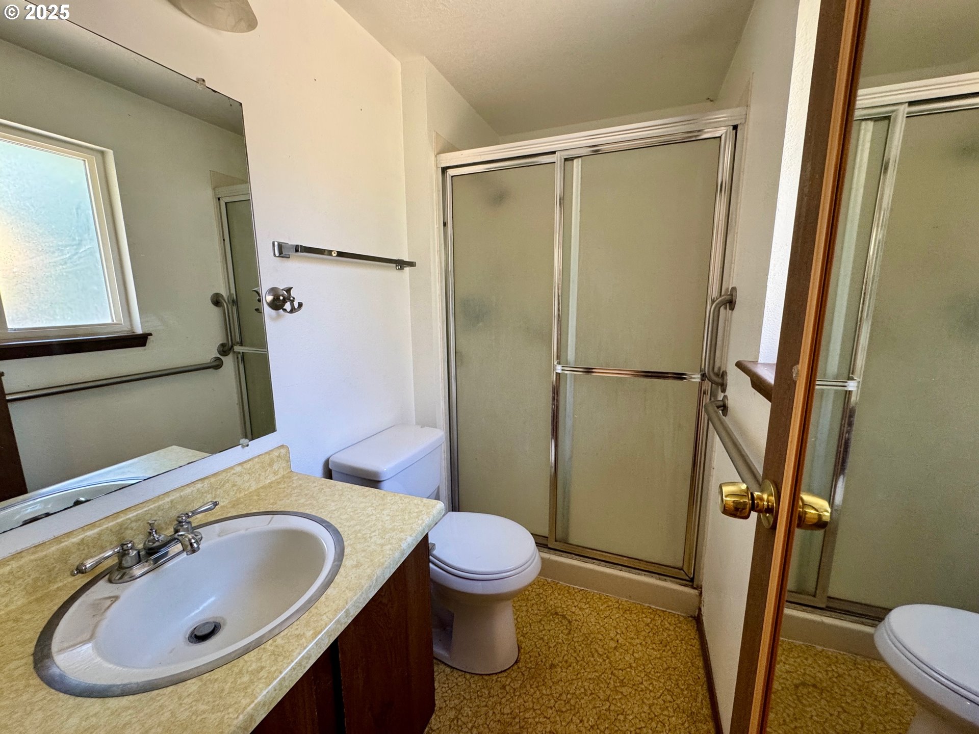 1275 West 1st Street Arlington, OR 97812 - Photo 18 of 24 a bathroom with a sink toilet and shower