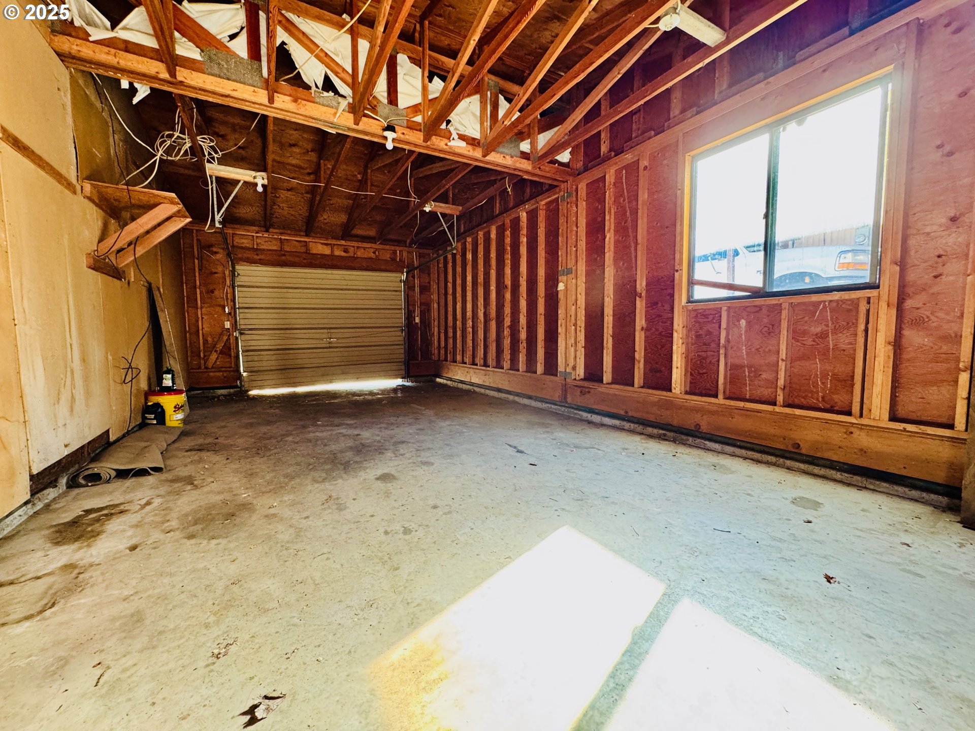 1275 West 1st Street Arlington, OR 97812 - Photo 22 of 24 a view of a room with wooden walls and window