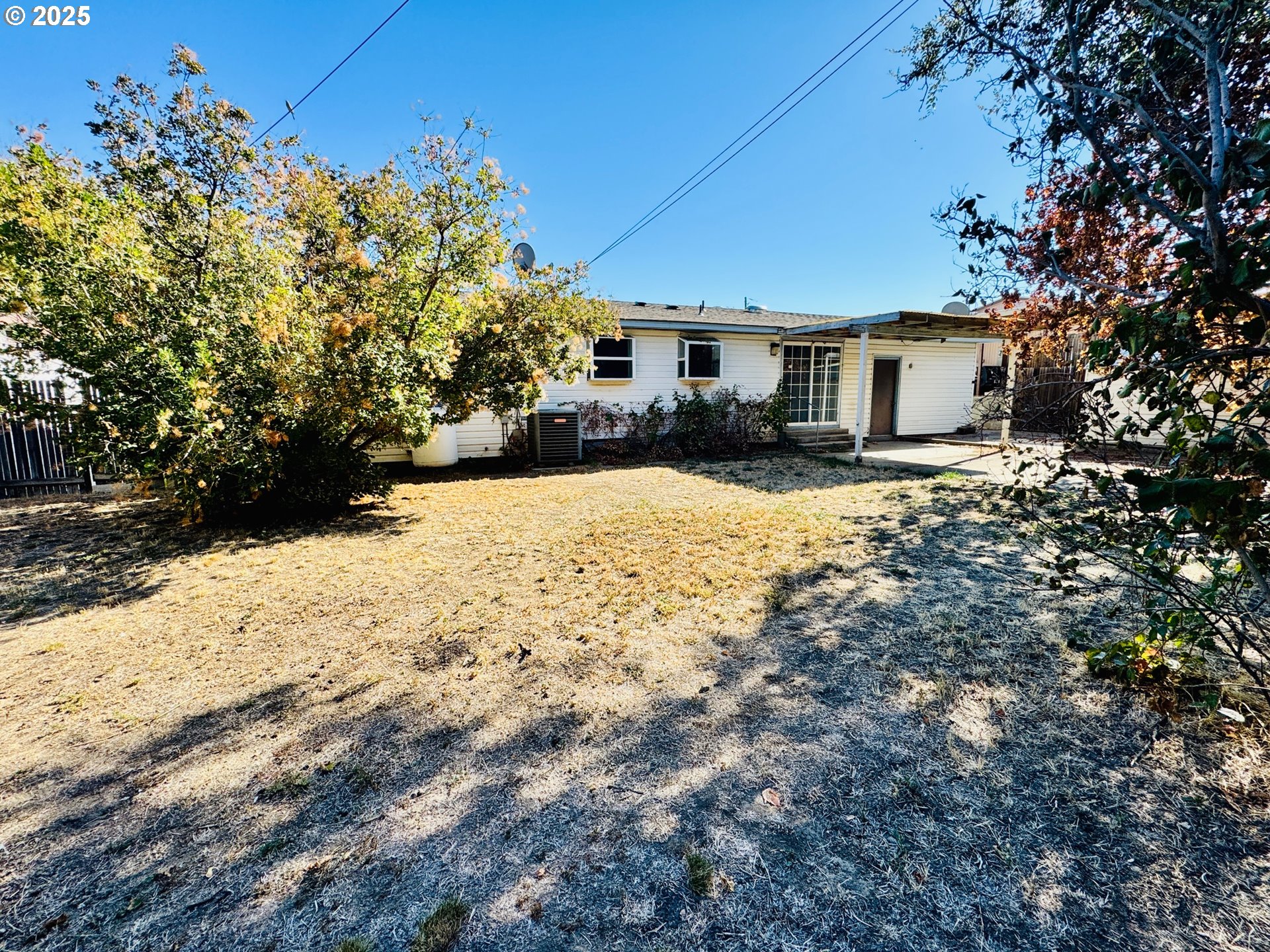 1275 West 1st Street Arlington, OR 97812 - Photo 23 of 24 a front view of a house with a yard