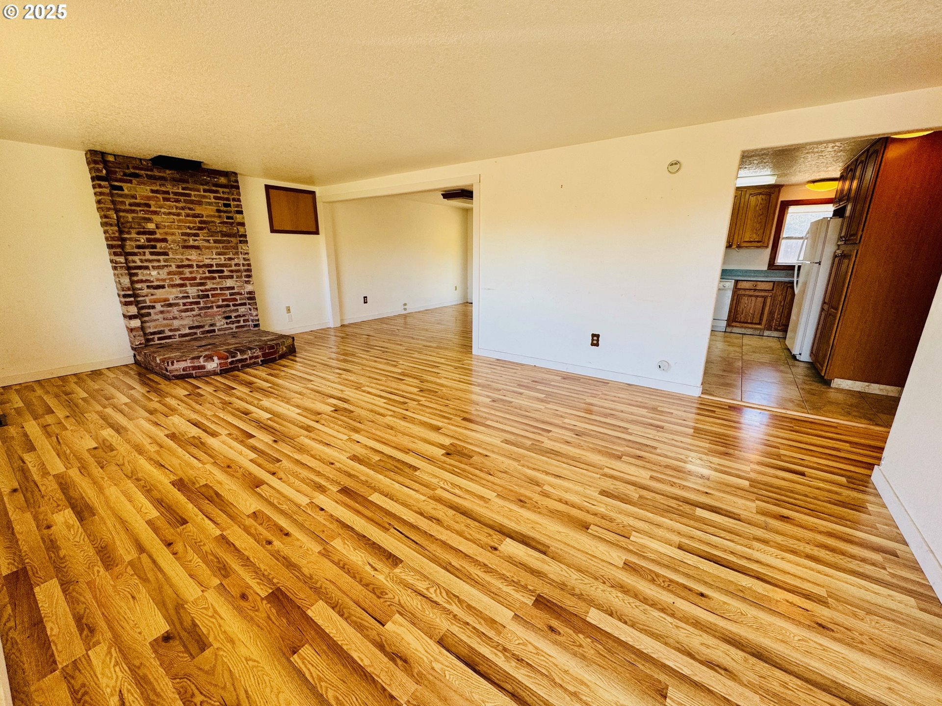 1275 West 1st Street Arlington, OR 97812 - Photo 7 of 24 a view of empty room with wooden floor
