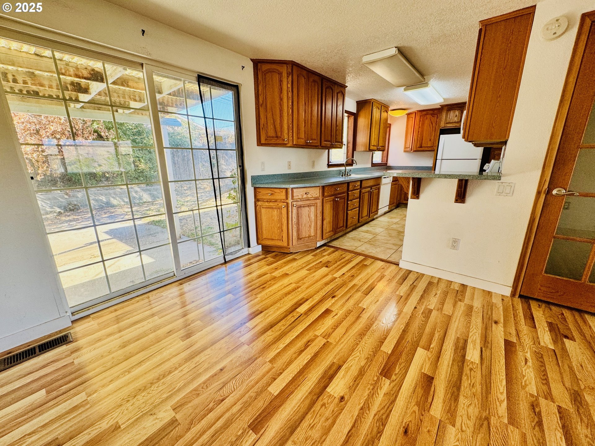 1275 West 1st Street Arlington, OR 97812 - Photo 10 of 24 a view of kitchen with wooden floor