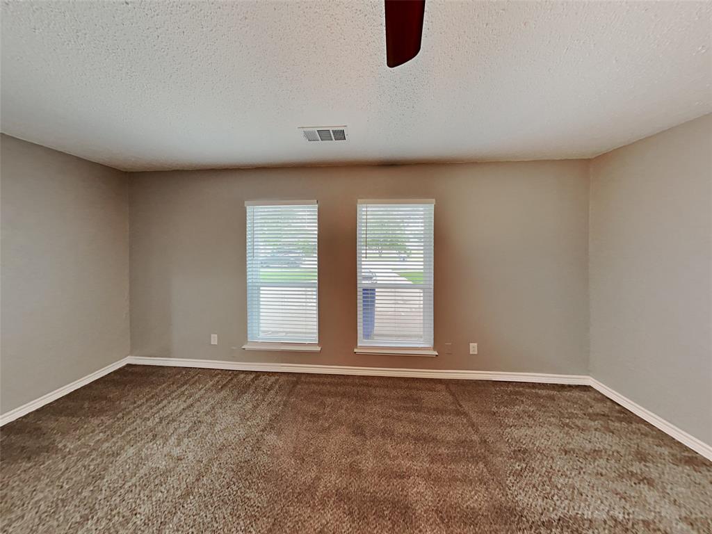 702 Redbud Drive Forney, TX 75126 - Photo 11 of 16 an empty room with a window