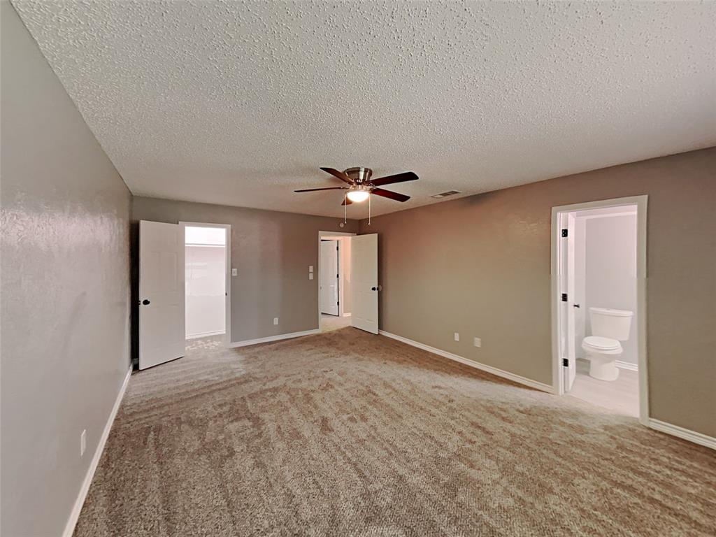 702 Redbud Drive Forney, TX 75126 - Photo 13 of 16 a view of empty room with a ceiling fan