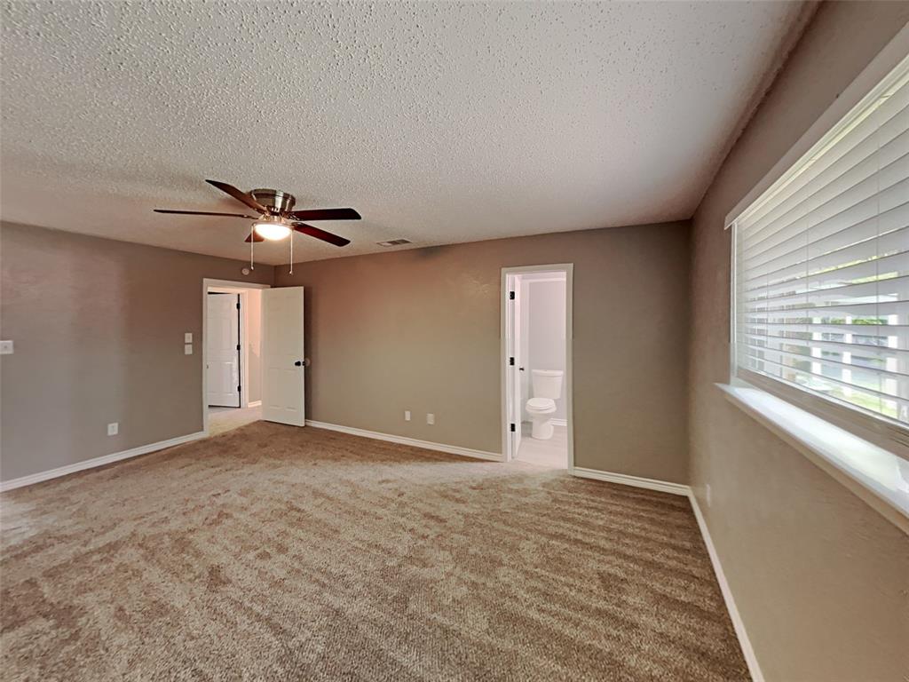 702 Redbud Drive Forney, TX 75126 - Photo 14 of 16 a view of an empty room and window