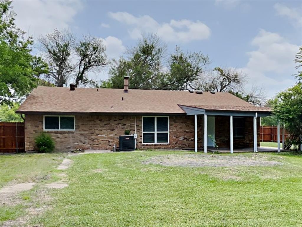 702 Redbud Drive Forney, TX 75126 - Photo 16 of 16 a front view of a house with garden